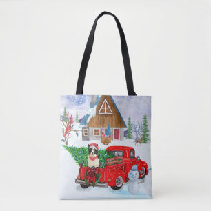 Band collie dog in kerstcadeau vrachtwagen sneeuw draagtas