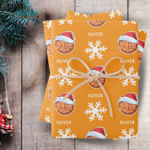 Basketbalbal met Rode Kerstman Hoed Sneeuwvlok Naa Inpakpapier Vel