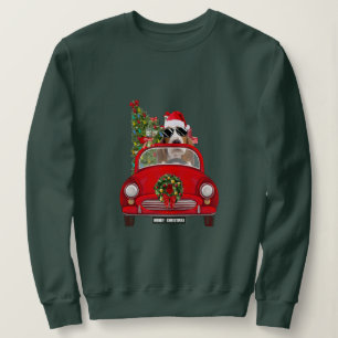 Basset Hound-hond rijdt in auto met Kerstmis Trui