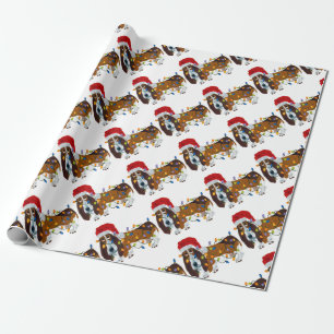 Basset in de knoop met kerstverlichting cadeaupapier
