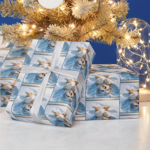 Bearded Collie maakt een sneeuwengel Cadeaupapier