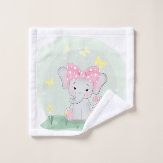 Beau éléphant avec un arc rose dans une clairière (Gant de toilette)