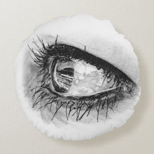 Beau oeil de femme en mascara sur coussin rond