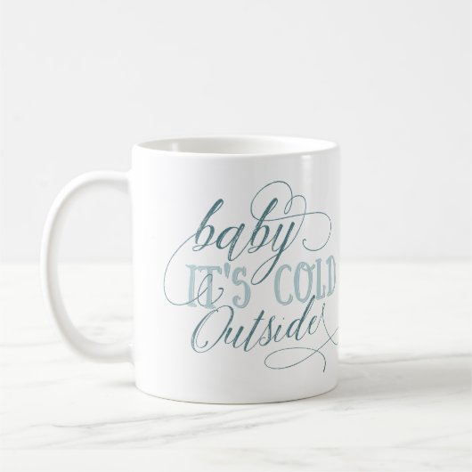 Bébé c'est tasse extérieure froide de citation de (Gauche)