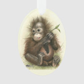 Bébé d'orang-outan avec le feuille (devant)