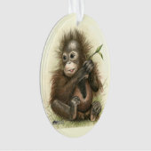 Bébé d'orang-outan avec le feuille (devant)