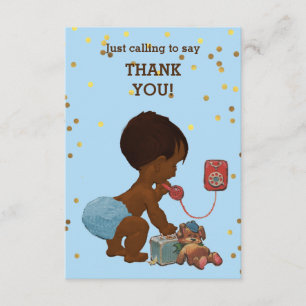 Bébé ethnique de confettis d'or sur le Merci de