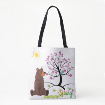 Beer ziet de bloeiende boom en vogel