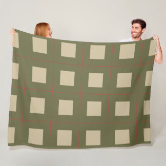 Beige vierkanten op een groene achtergrond met een fleece deken