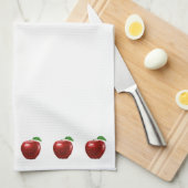 Belles pommes rouges sur une serviette de cuisine (Quart Plié)