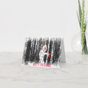 Bigfoot dans la carte de Noël de forêt