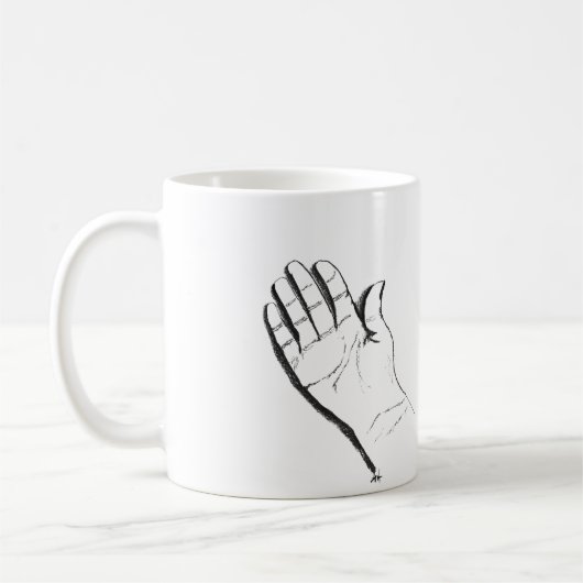 black and white hand on coffee mug koffiemok (Links)