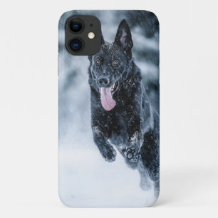 Black German Shepherd in snow Duvet Cover