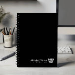BLACK Minimal Monogram Initial CORPORATE BUSINESS<br><div class="desc">Elevate your daily planning with this modern minimalist notebook, designed in a clean black-and-white color palette that suits both professional and personal use. Your custom name appears in the lower right corner in a refined line-style font, paired with a striking monogram initial created in the distinctive Monoton typeface. With its...</div>