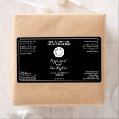Black w curly text logo cosmetics bottle label  (Insitu)
