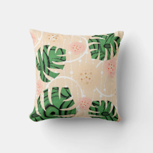 blad monstera op roze kussen