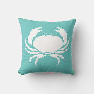 BLANC DE CRABE sur coussin bleu turquoise