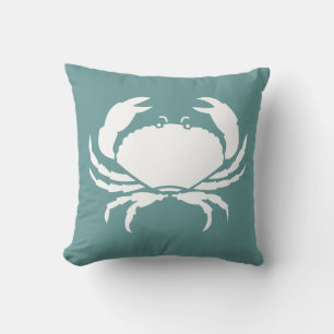 BLANC DE CRABE sur coussin bleu turquoise foncé