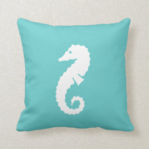 BLANC d'HIPPOCAMPE sur le coussin bleu turquoise