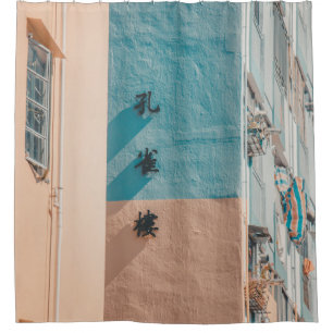 BLAUW EN BEIGE WAL MET KANJI SIGNAGE DOUCHEGORDIJN