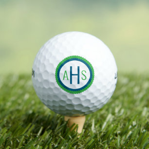 Blauw en groen geschulpte drielettermonogram golfballen