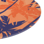 Blauw palmsilhouet, oranje achtergrond snijplank (Hoek)