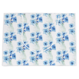 Blauwe bloemen in glazen vaas groot cadeauzakje