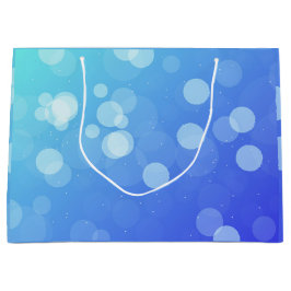 Blauwe cadeautas met witte touw handvatten