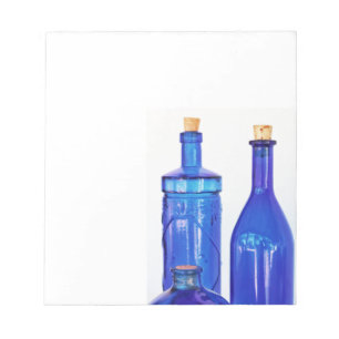 Blauwe glazen flessen notitieblok