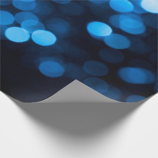 Blauwe glitter bokeh textuurlichten cadeaupapier (Hoek)