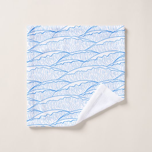 Blauwe handdoek set met illustratief golfpatroon (Wasdoekje)