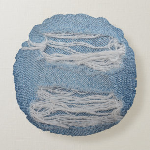Blauwe scheuren ontkennen jeans textuurachtergrond rond kussen