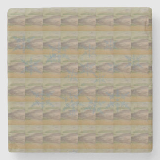 Blauwe sneeuwvlokgolven op het strand stenen onderzetter