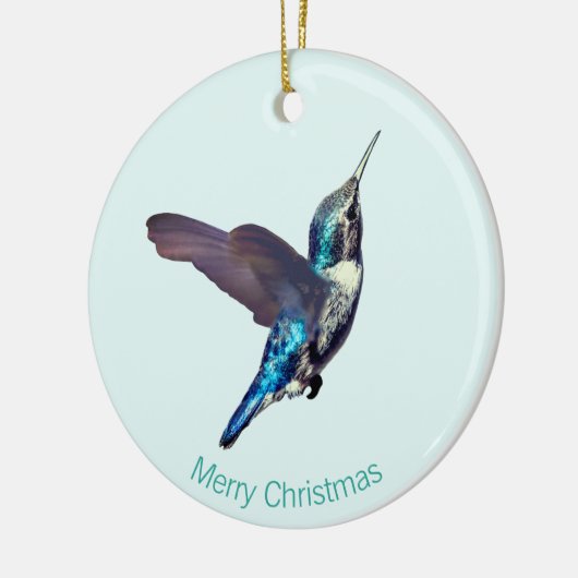 Blauwe turquoise kolibrie op lichtblauw keramisch ornament (Links)