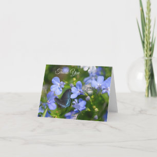 Blauwe vlinder op een blauwe ventilator kaart