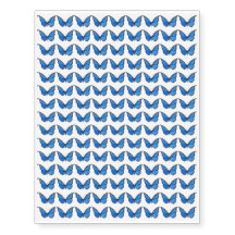 Blauwe vlindermini-tattoos, tijdelijk gefixeerd