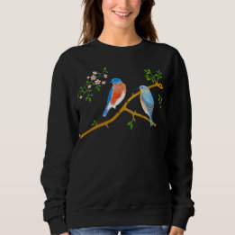 Blauwe vogels dragen zwarte sweatshirt