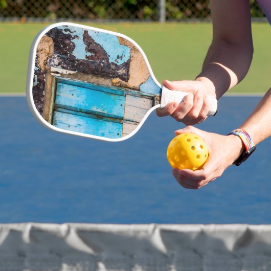 Blauwe wand en deur pickleball paddle (Insitu)