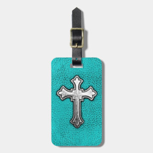 Blauwgroen metalen kruis bagagelabel