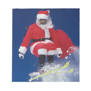 Bloc-note Le père noël sur sauter de skis outre d'une