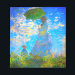 Bloc-note Monet Woman avec un parasol<br><div class="desc">Un bloc-notes de portrait familial avec Camille,  épouse de Claude Monet,  tenant un parasol,  et son fils Jean,  se promenant dans un champ vert vif soufflé par le vent pendant une journée d’été. Un grand cadeau Monet pour les amateurs d'impressionnisme et d'art français.</div>