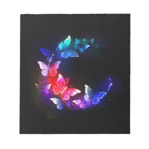 Bloc-note Papillons de nuit néon lumineux sur fond noir