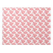 Bloc-note Un Motif à fleurs rouge et blanche sur un fond bla (Devant)