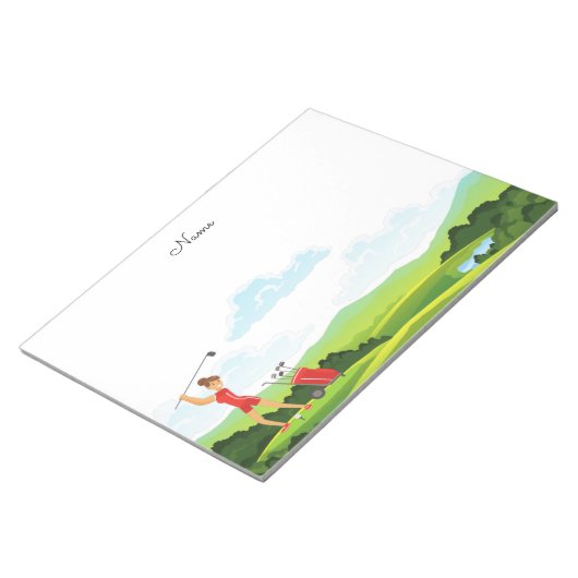 Bloc-note Une golfeuse en rouge sur vert (Incliné)