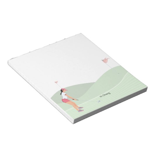 Bloc-note Une golfeuse joue sur le parcours (Incliné)