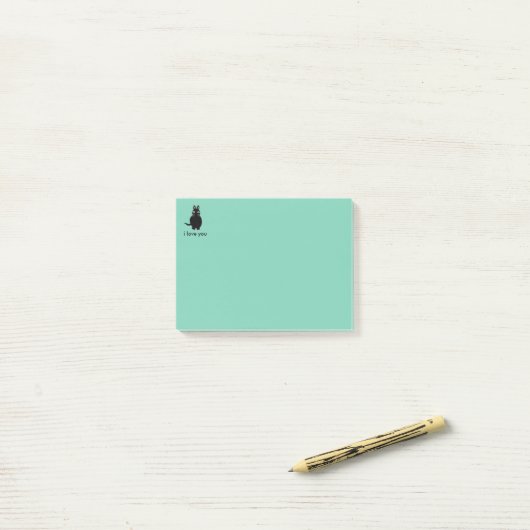 Bloc-notes collant de post-it de chat (Sur un bureau)