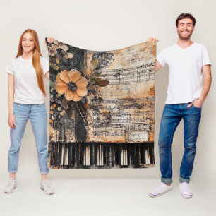 Bloemen met rustieke pianotoetsen en verouderde mu fleece deken