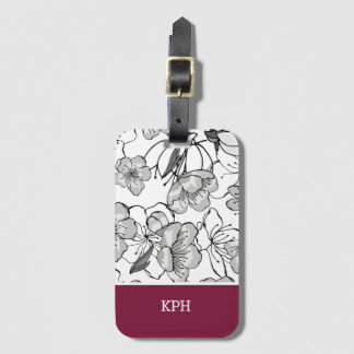 Bloemen zwart, wit en rood met monogram bagagelabel