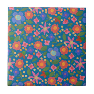 Bloemmotief in folk art stijl op blauwe keramische tegeltje