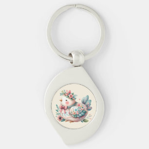 Bloemrijke volksvogel met pastel boho charme sleutelhanger